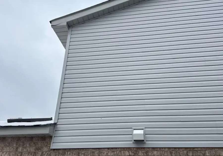 New grey siding on the side of a Brampton home