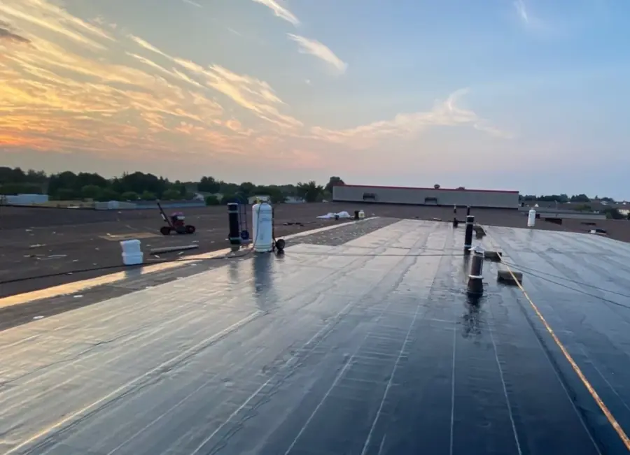 A large finished commercial flat roof at sunset in Woodstock, Ontario